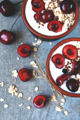 Breakfast oatmeal with yogurt and sweet cherries. Kefir and oatmeal. Probiotics. Fermented dairy products.
