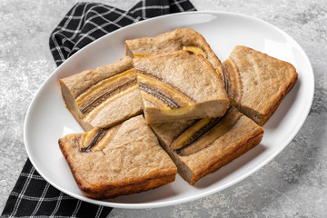 Banana bread on gray background.