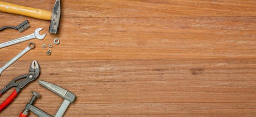 Tools on a wooden background with copy space