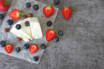 White cheese, strawberries, blueberries, nuts. Keto diet. Keto lunch idea. 