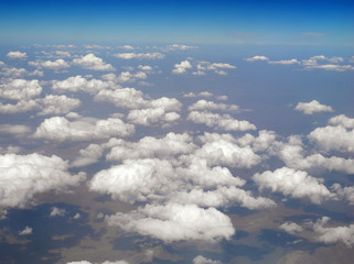 Fototapeta na wymiar Aerial landscape of small clouds over mountainous terrain