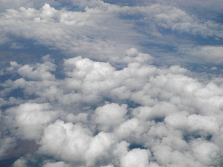 Aerial landscape of small clouds above a green Europe valley