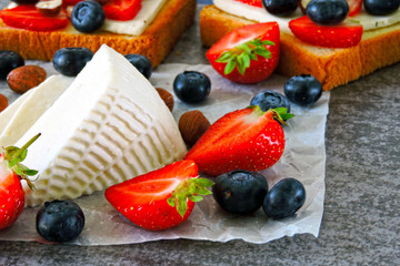 White cheese, strawberries, blueberries, nuts. Keto diet. Keto lunch idea. 