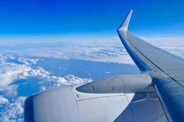 Airplane wing and clouds at high altitude. Travel themes © ADV Photos