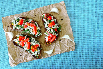 Toast with white cheese, herbs and garlic. Toasts of rye bread with white cheese and garlic. 