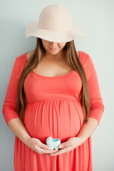 pregnant woman in orange dress