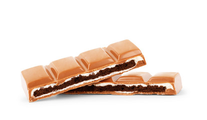 Milk chocolate pieces isolated on white background