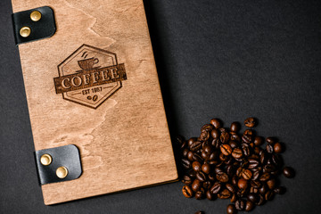 a tree with a logo for coffee, coffee beans, a designer thing.