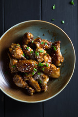 Teriyaki chicken wings with sesame and green onions