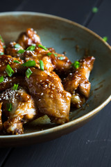 Teriyaki chicken wings with sesame and green onions