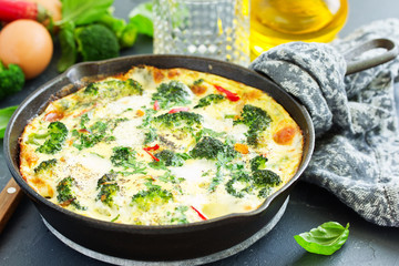 Frittata with vegetables and broccoli. View from above. Selective focus.