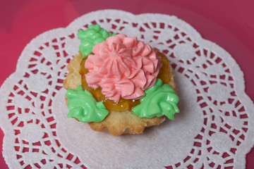 Basket cake decorated with cream of different colors. Stuffing from jam.