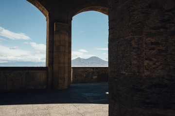 Vesuvius view through the castle Castel dell'Ovo arches