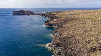 Fototapeta premium Aerial view of the lighthouse Teno on The Tenerife, Canary Islands, Spain. Wild Coast of the Atlantic Ocean