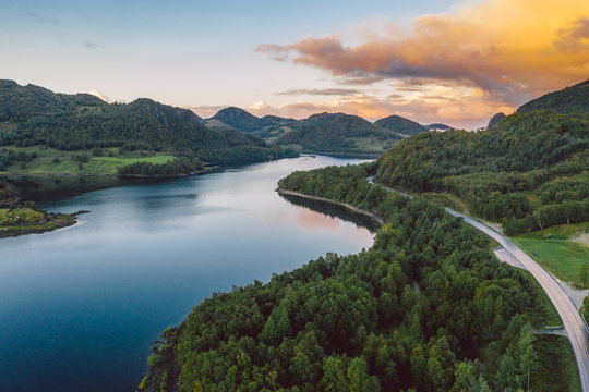 a lake in Norway with beautiful sunrise in background