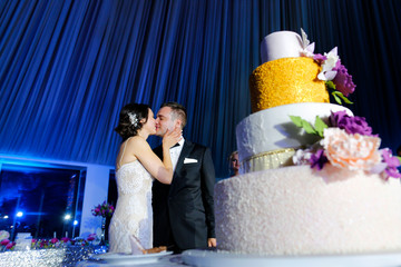Bride and groom are kissing for celebration on their wedding day