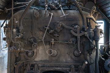 Part of the railway abandoned steam locomotive depot rusty old remnants. Steam boiler.