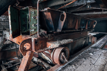 Old rusty trolley in abandoned factory