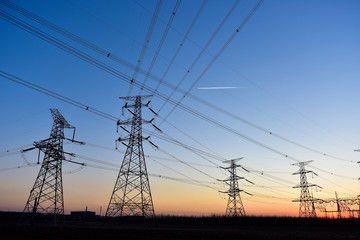 Fototapeta premium In the evening, the outline of the transmission tower