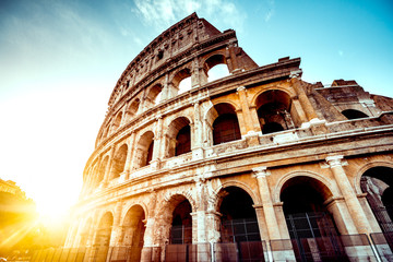 Naklejka premium The ancient Colosseum in Rome at sunset