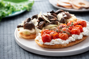Bruschetta with tomatoes and mushrooms, italian food.