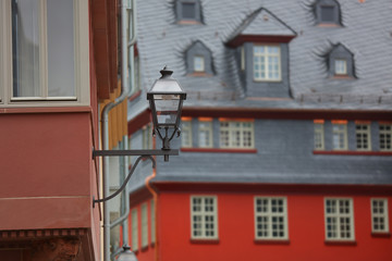 Fototapeta na wymiar Colorful building exterior and lamp post