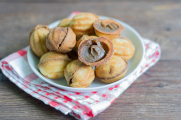delicious homemade butter cookies with boiled condensed milk on a wooden background