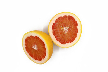 sliced fresh half grapefruits - isolated on white