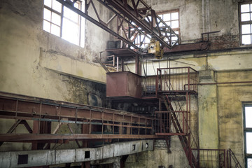 Fototapeta na wymiar Old rusty gantry crane in abandoned factory