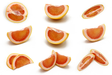 grapefruit - set of fresh  sliced grapefruit pices  isolated on white