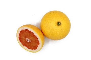 fresh whole and sliced grapefruit  isolated on white