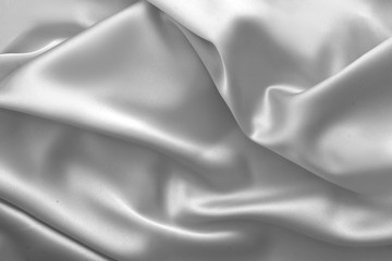 Obraz premium Rippled white silk fabric satin cloth waves background