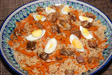 Rice with meat, carrot, vegetables and eggs on the top, also called as polaw, plov