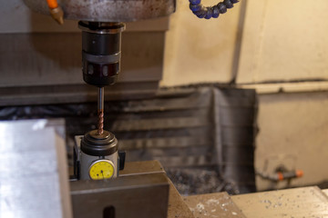The  tool length offset measurement process on CNC milling machine.The machining center with tool...
