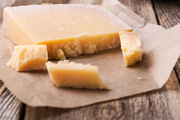 Parmesan cheese on rustic wooden table
