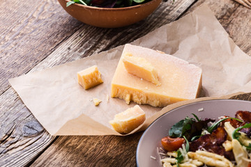 Parmesan cheese on rustic wooden table