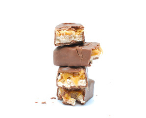 chocolate and nuts energy bar on white close up photography image