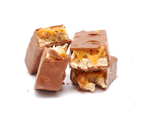chocolate and nuts energy bar on white close up photography image
