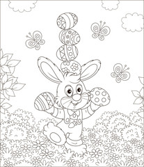 Little Easter bunny juggling with colored eggs among flowers on grass of a lawn on a sunny spring day, black and white vector illustration in a cartoon style for a coloring book