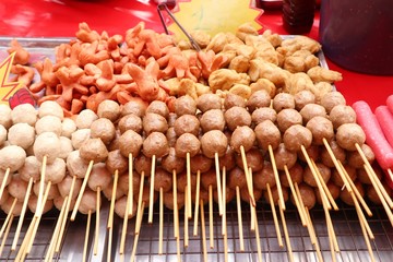 Fried meatballs and sausage at street food