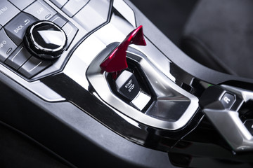 Obraz na płótnie Canvas Close up of engine start button in sports car
