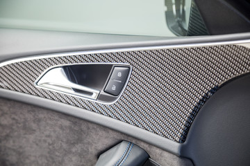 Carbon fibre trim in black car interior