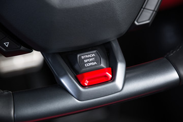 Driving modes option button in super car
