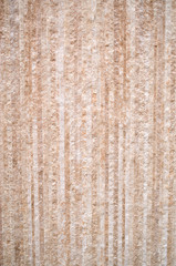 Cladding slab with vertical lines on wall