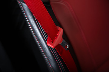 Close up of red car seat belt