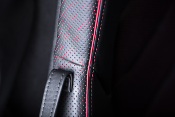 Close up of contrast stitching on car seat
