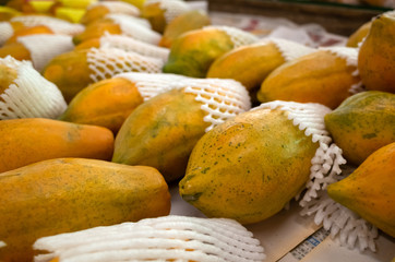 papaya fruit stacked on the marketplace