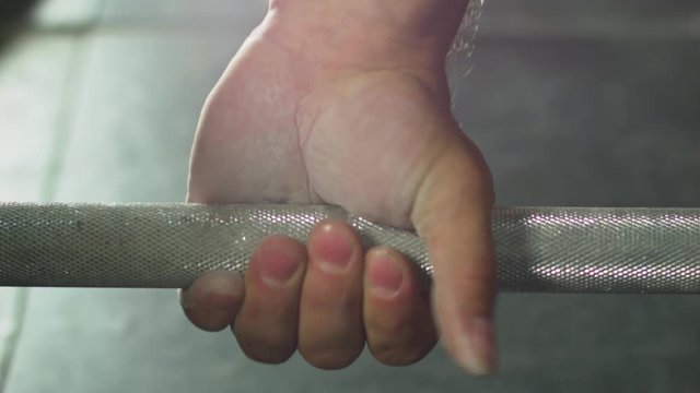 Hand on the barbell. Close up  BMCC 2.5K resolution: 2400 x 1350