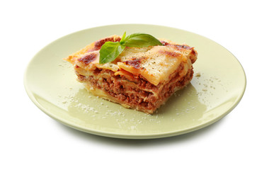 Plate with tasty baked lasagna on white background