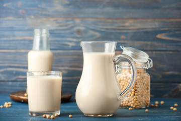 Tasty soy milk on wooden table